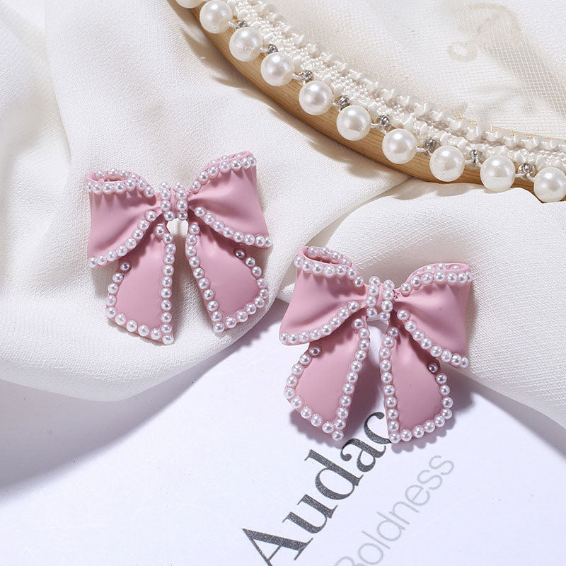 Pearl Embellished Bow Stud Earrings